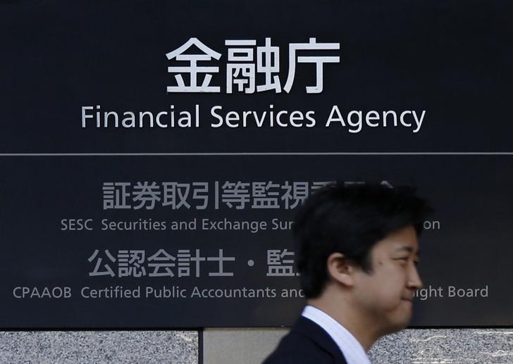 man walks by Japan's Financial Services Agency